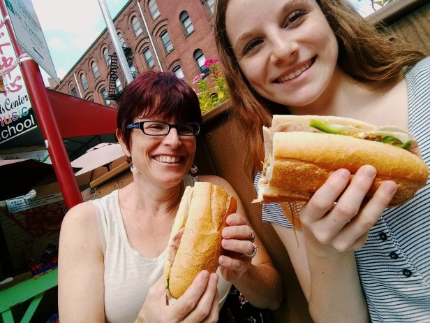 Katny & Tobey sharing Bahn Mi QT Sandwich Shop Chinatown Philadelphia